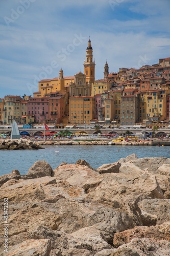  Panoramic view of colorful old town Menton and locals enjoying water activies in the sea on a hot summer day in french Riviera, France photo