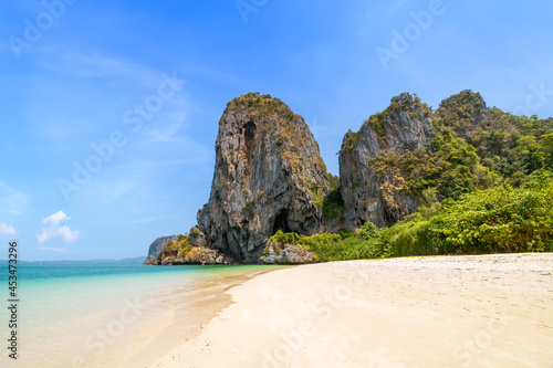 Ao Phra Nang near Railay beach with crystal clear water and exotic landmark limestone cliff mountain, Krabi, Thailand photo