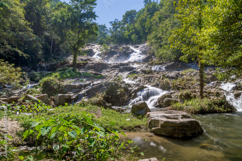 Fototapeta Naklejka Na Ścianę i Meble -  Khlong Nam Lai Waterfall, large and exotic waterfall in tropical forest in National Park, Kamphaeng Phet, Thailand