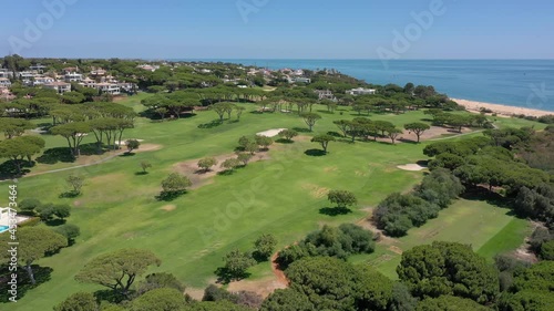 Aerial video shooting of a tourist village on the Atlantic Ocean, with golf courses, Vale de Lobo. Portugal Algarve.