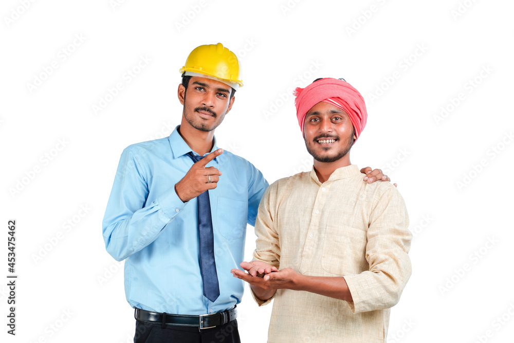 Young indian engineer with farmer on white background. Young indian engineer with farmer on white background.