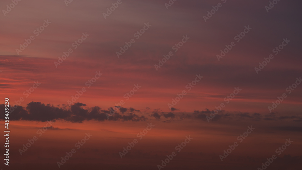 Sunset clouds in the sky in summer evening