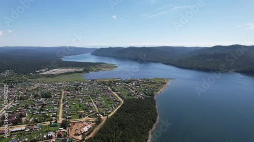 The Angara River is a major river in Siberia leaving Lake Baikal near the settlement of Listvyanka. Panoramic aerial view.