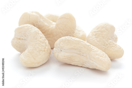 Micro close-up and details of Organic Indian dry fruit cashew nut (Anacardium occidentale)    isolated over white background.