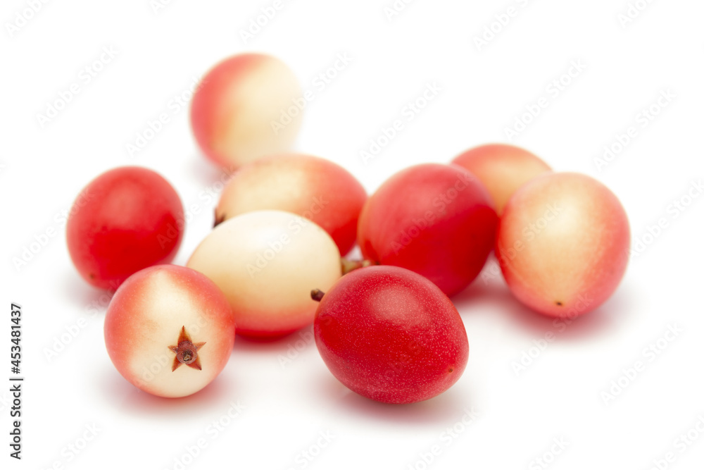Micro close-up and details of Organic white pink Indian karonda (Carissa carandas) carandas plum and karanda isolated over white background. Micro close-up and details of Organic white pink Indian karonda (Carissa carandas) carandas plum and karanda isolated over white background.