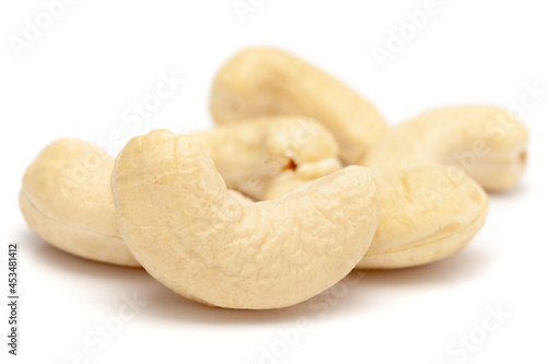 Micro close-up and details of Organic Indian dry fruit cashew nut (Anacardium occidentale)    isolated over white background. photo