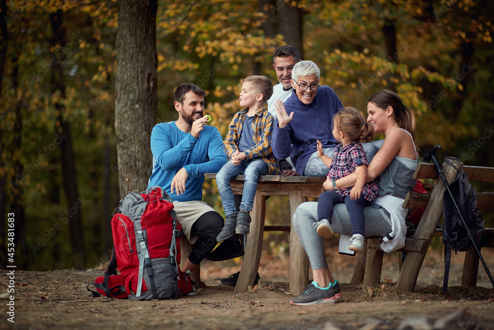 A happy family enjoying together in the forest A happy family enjoying together in the forest