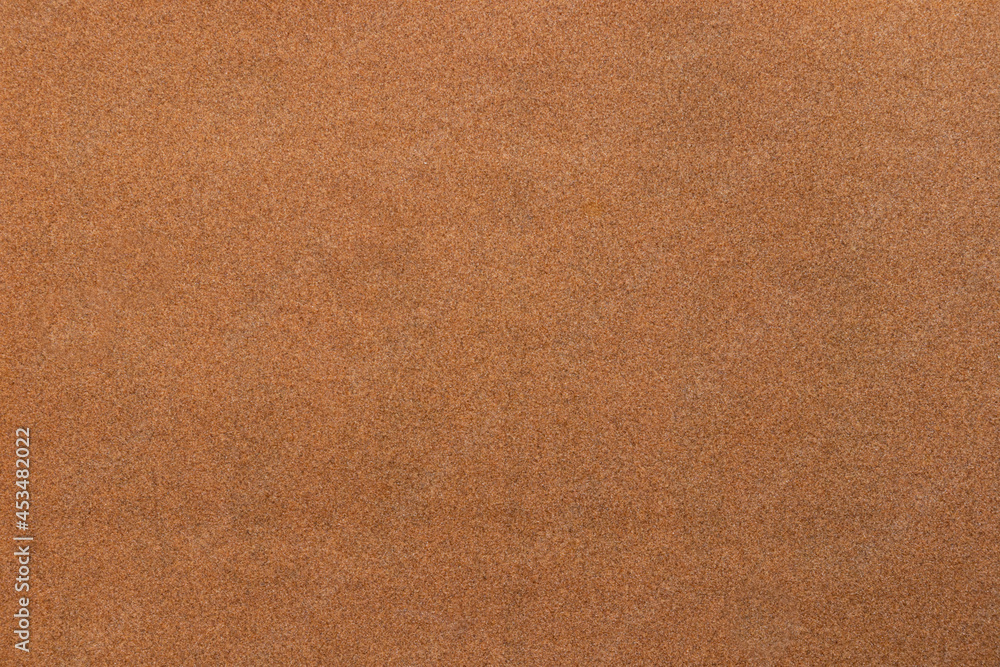 Sandpaper texture background where you can see the red-brown sand grain pattern on the sandpaper, suitable as a background for inserting text. Copy Space for designers to use on sandpaper. Sandpaper texture background where you can see the red-brown sand grain pattern on the sandpaper, suitable as a background for inserting text. Copy Space for designers to use on sandpaper.