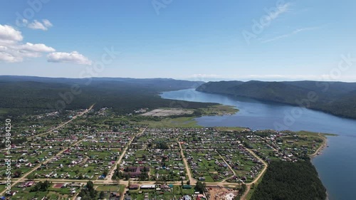 The Angara River is a major river in Siberia leaving Lake Baikal near the settlement of Listvyanka. Panoramic aerial view.