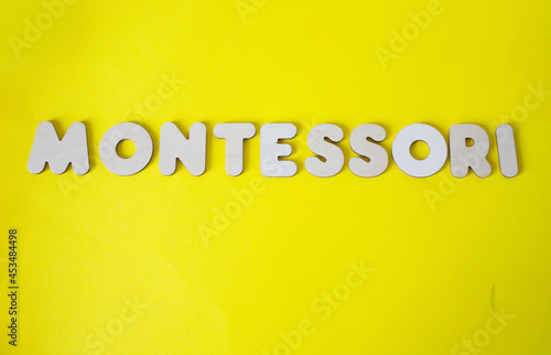 montessori logo on a yellow background