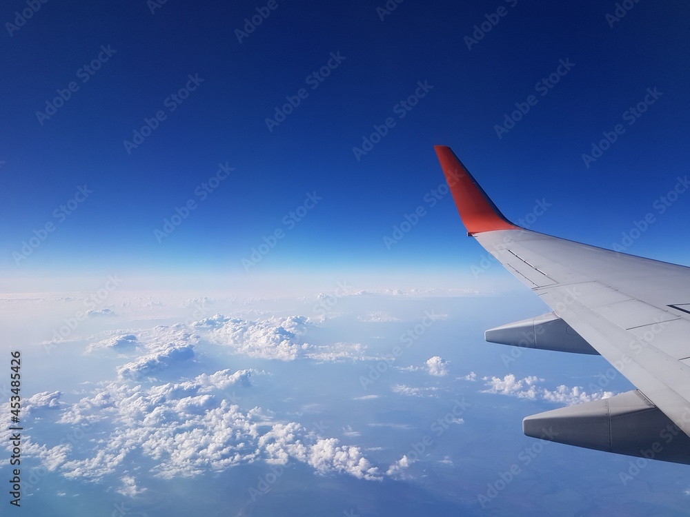 Fototapeta premium Wing aircraft in the blue sky