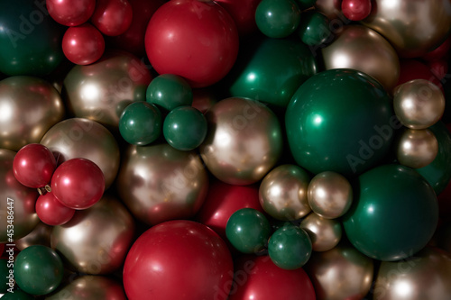 christmas decorations with colored balloons on background