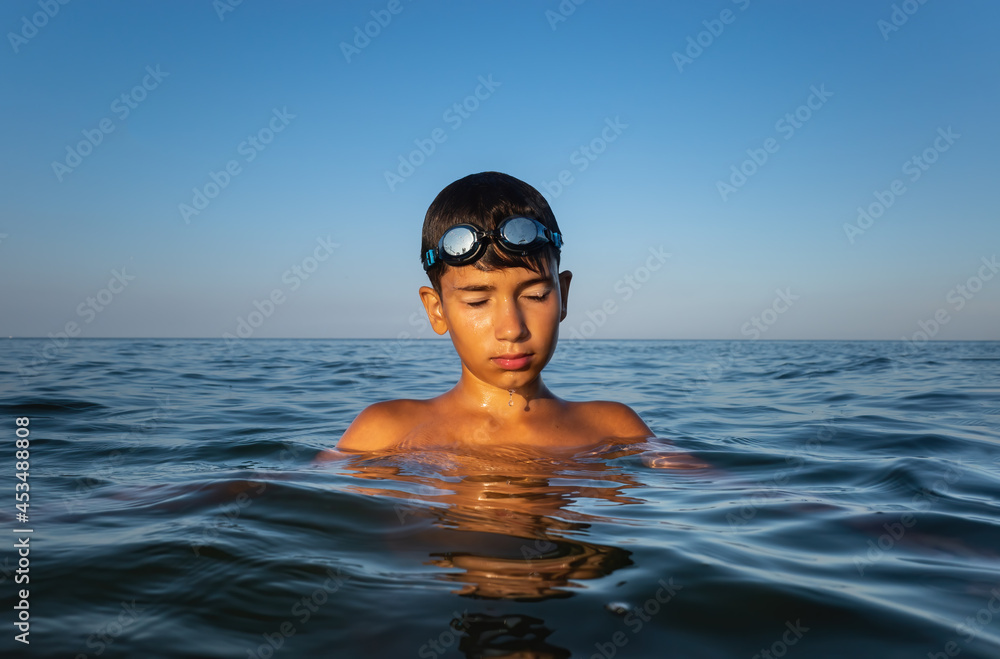  boy bathes in the sea