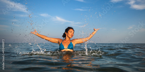 woman swims in the sea © misu