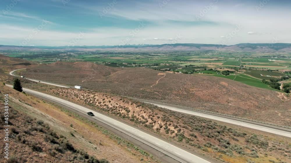 Aerial: Freeway and farms in the countryside. Yakima, Washington, USA Aerial: Freeway and farms in the countryside. Yakima, Washington, USA