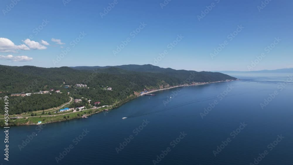 The Angara River in Siberia leaving Lake Baikal near the settlement of Listvyanka. Panoramic aerial view. The Angara River in Siberia leaving Lake Baikal near the settlement of Listvyanka. Panoramic aerial view.