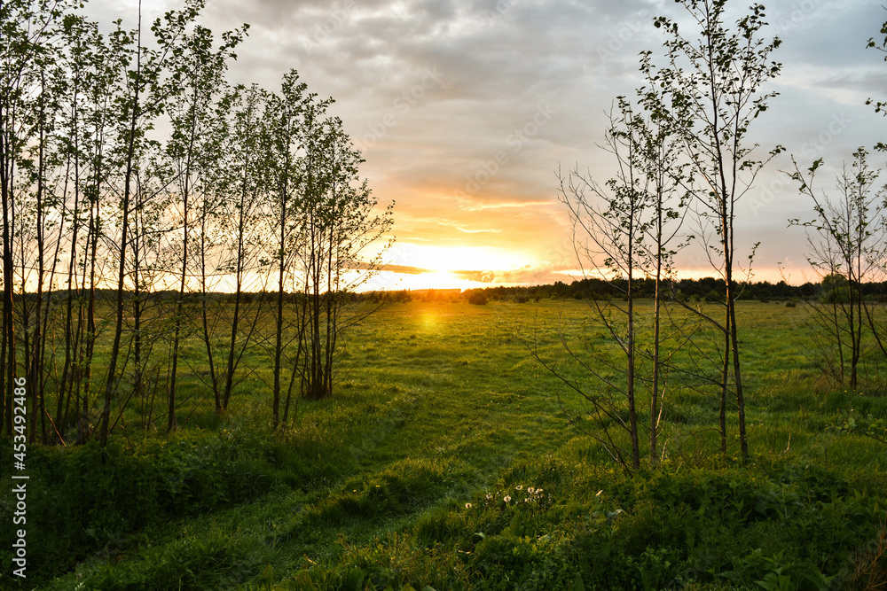 Lower Narew Valley, sunset on the Narew River, Łomża, Poland Lower Narew Valley, sunset on the Narew River, Łomża, Poland