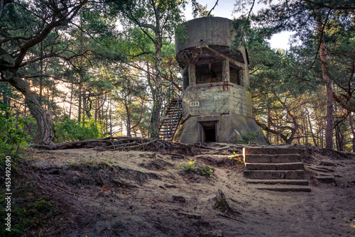 Old concrete infantry bunker in the woods of Hel, Poland. Old military fortification from World War Two and Cold War. Guard outpost on the hill.