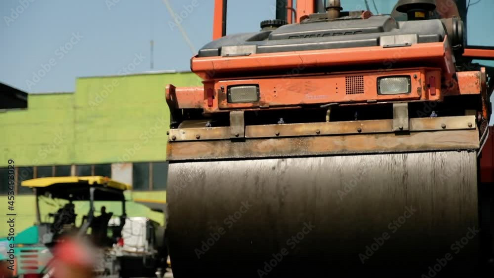 A roller for laying asphalt in action. The plan from below. A roller for laying asphalt in action. The plan from below.