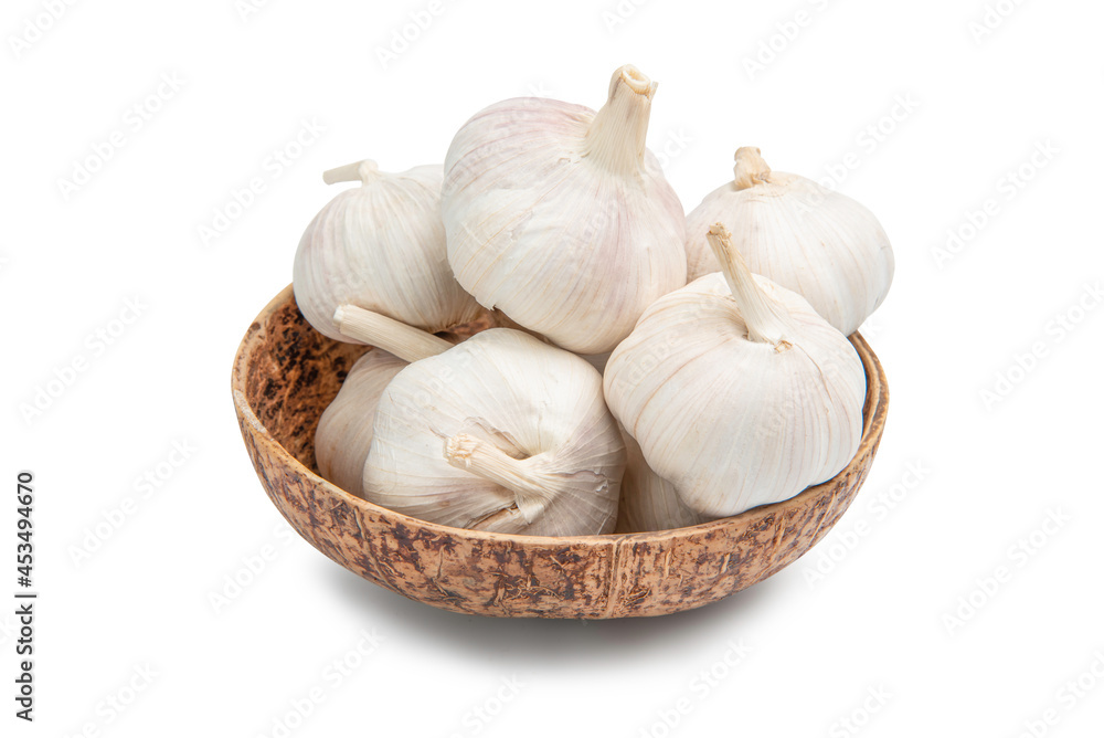 Fresh Garlic Bulb in wooden bowl.isolated on white background. Fresh Garlic Bulb in wooden bowl.isolated on white background.