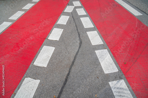 Cycle path with red marking on the road