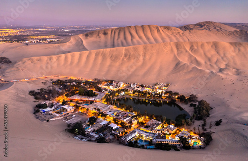 Aerial sunset view of the Huacachina Oasis in Peru photo