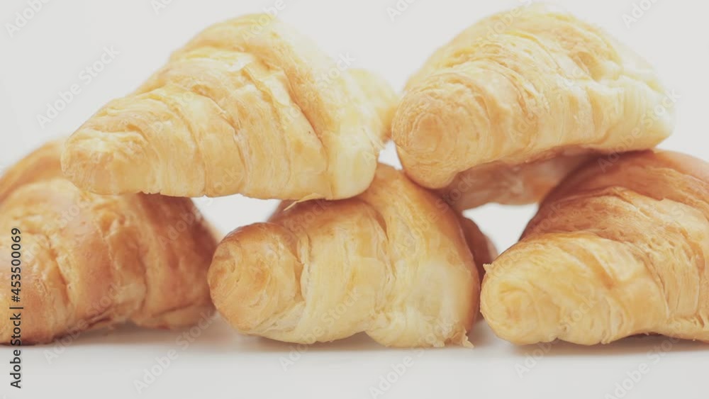 croissant lies on a white background. baked goods on isolated background croissant lies on a white background. baked goods on isolated background