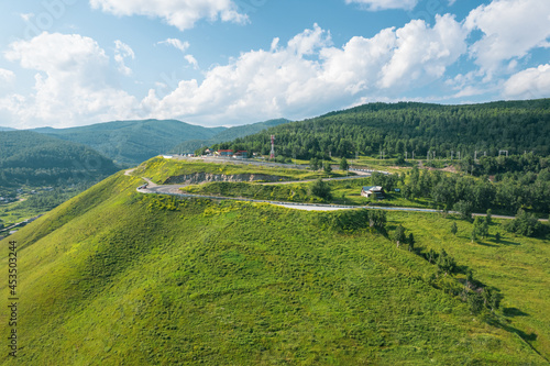 The Baikal serpentine road - aerial view of natural mountain valley with serpantine road, Trans-Siberian Highway, Russia, Kultuk, Slyudyanka photo