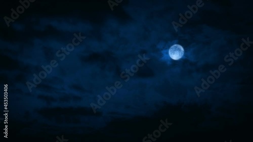 Lightning Strikes In Night Sky With Full Moon photo