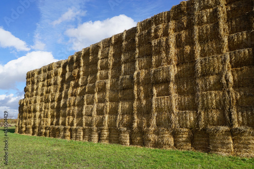 huge stack of bales of hay in a field france