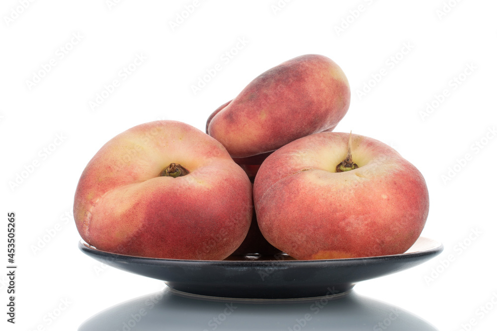 Several juicy organic peaches with ceramic dishes, close-up, isolated on white. Several juicy organic peaches with ceramic dishes, close-up, isolated on white.