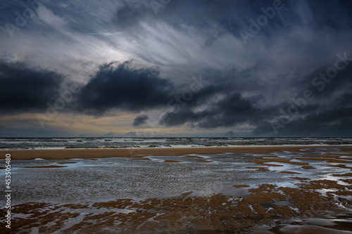 Beach of Katwijk aan Zee on a stormy day, South Holland Province, The Netherlands photo