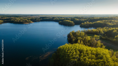 Aerial view of the lake or river with pattern wave. Water surface with ripples texture background. Viewed from above. Environment concept. © kalyanby