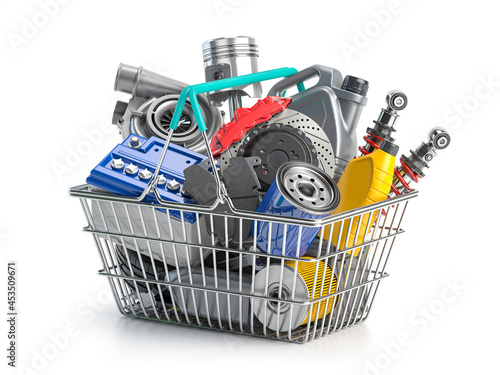 Car parts and auto spare in shopping basket isolated on white. photo