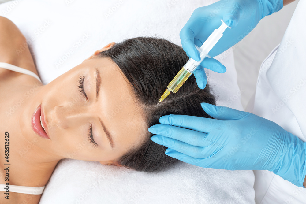 Cosmetologist does prp therapy of a beautiful woman in a beauty salon. Cosmetology concept. Cosmetologist does prp therapy of a beautiful woman in a beauty salon. Cosmetology concept.