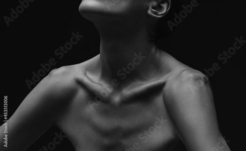 Black-white silhouette of female shoulders and arms. Female silhouette.