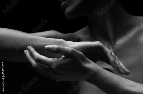 Black-white silhouette of female shoulders and hands . Female silhouette.