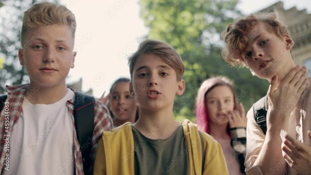 Group of angry bullies looking at cam, bullying problem, violence at school Group of angry bullies looking at cam, bullying problem, violence at school