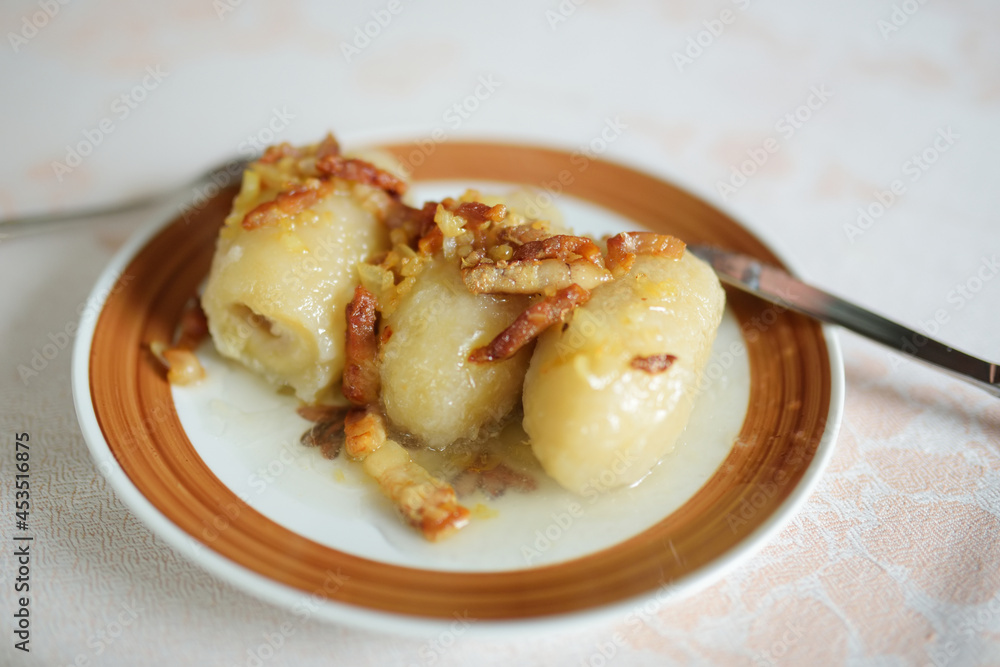 Lithuanian cepelinai, dumplings made of grated and riced potatoes and stuffed with ground meat, dry curd cheese or mushrooms.