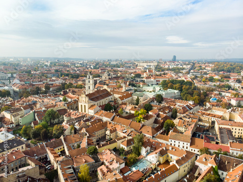 Beautiful Vilnius city panorama in autumn with orange and yellow foliage. Aerial evening view. © MNStudio