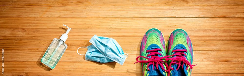 Fitness and coronavirus theme with running shoes Fitness and coronavirus theme with running shoes