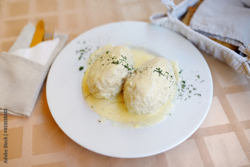 Lithuanian cepelinai, dumplings made of grated and riced potatoes and stuffed with ground meat, dry curd cheese or mushrooms. Lithuanian cepelinai, dumplings made of grated and riced potatoes and stuffed with ground meat, dry curd cheese or mushrooms.