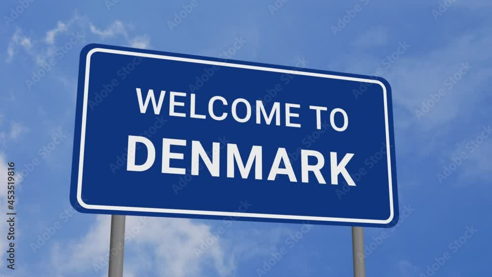 Welcome to Denmark Road Sign on Clear Blue Sky with Rapid Moving Clouds Welcome to Denmark Road Sign on Clear Blue Sky with Rapid Moving Clouds