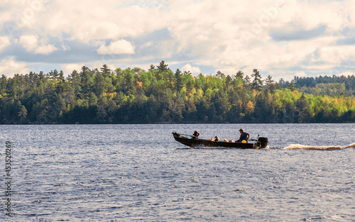 People are enjoying fishing and boating on a sunny day on Crane Lake, Voyageurs National Park, Minnesota photo