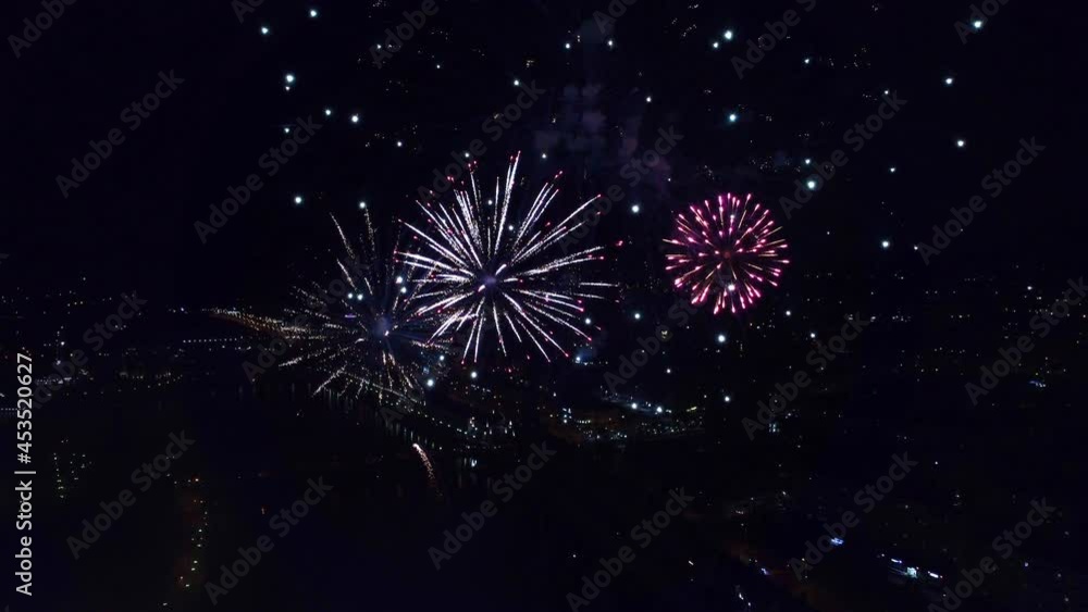 the drone shoots fireworks in 4k resolution at night in the city center on the river bank the drone shoots fireworks in 4k resolution at night in the city center on the river bank