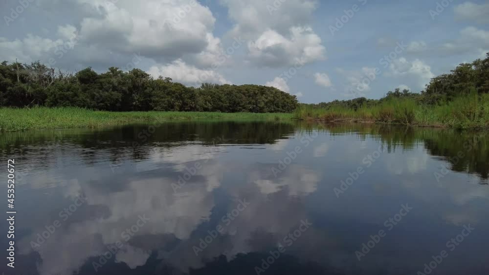 Late summer kayaking on Fisheating Creek near Palmdale, Florida on calm sunny day 4K. Late summer kayaking on Fisheating Creek near Palmdale, Florida on calm sunny day 4K.