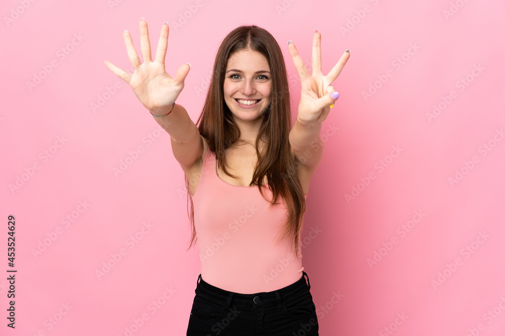 Young caucasian woman isolated on pink background counting eight with fingers Young caucasian woman isolated on pink background counting eight with fingers