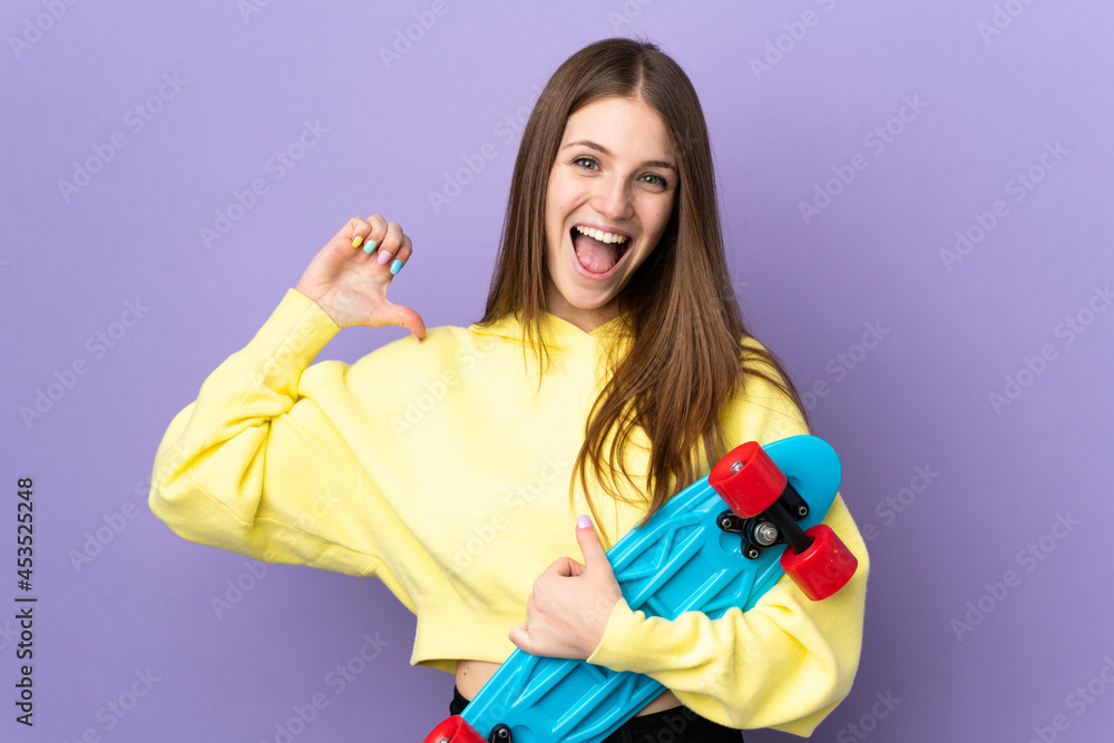 Young caucasian woman isolated on purple background with a skate with happy expression Young caucasian woman isolated on purple background with a skate with happy expression