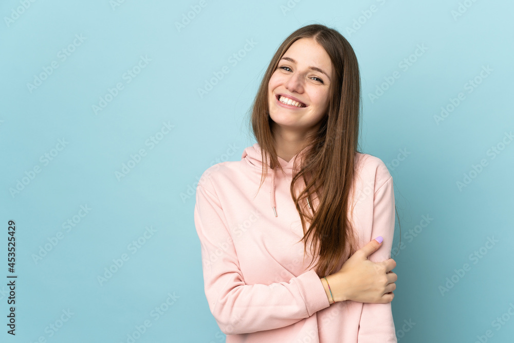 Young caucasian woman isolated on blue background laughing Young caucasian woman isolated on blue background laughing