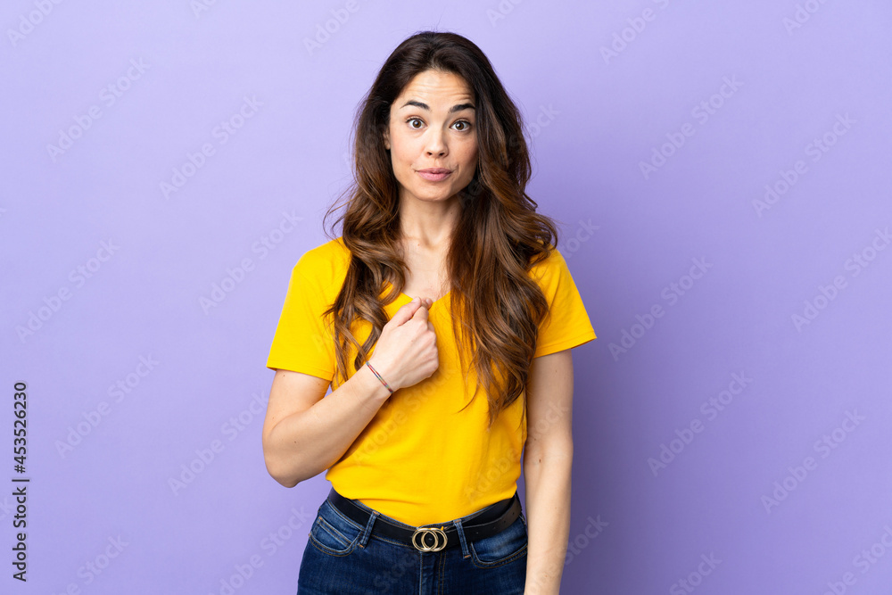 Woman over isolated purple background pointing to oneself Woman over isolated purple background pointing to oneself